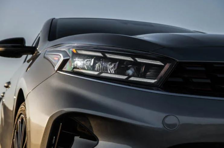 Close view of the front bumper/ headlight area of a gray 2022 Kia Forte. | Collision Center | Central Arkansas